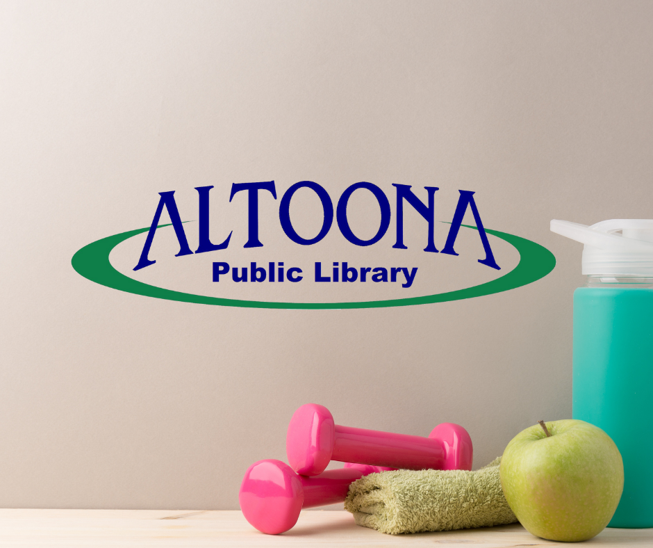 Water bottle, weights, apple, and towel setting on table with library logo on wall behind